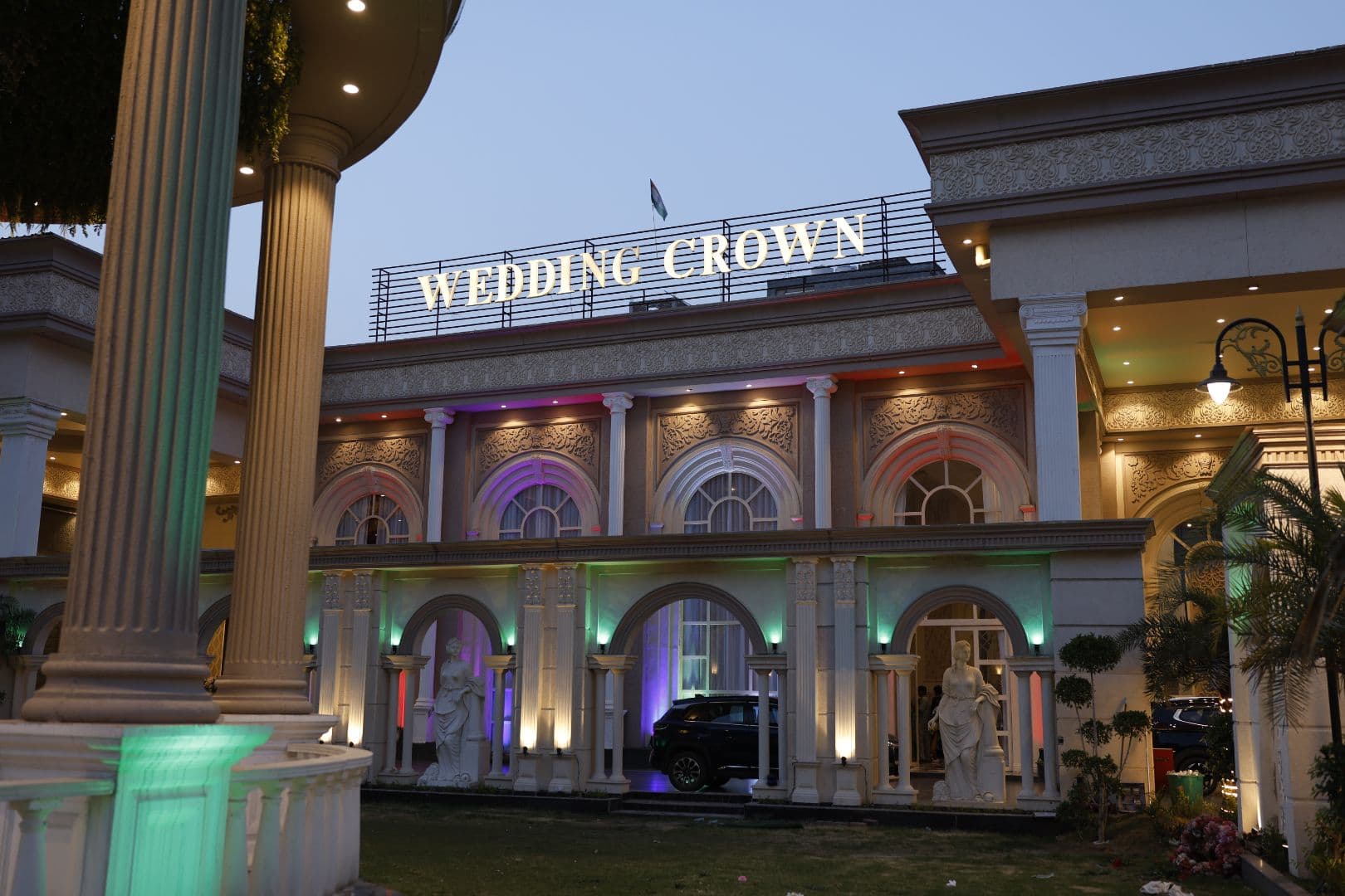 Elegant banquet hall interior at Wedding Crown with floral décor and ambient lighting